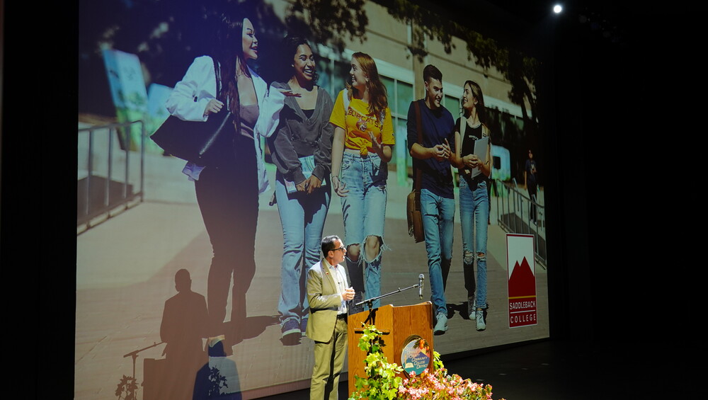 Saddleback president Elliot Stern speaking at podium