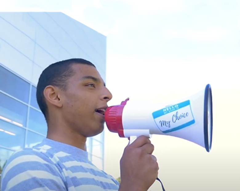 student holding a bull horn