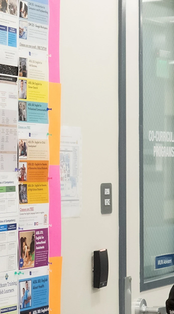 students looking at a bulletin board