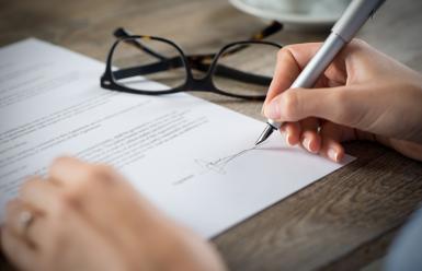 hand signing a form