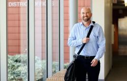 business man walking carrying bag