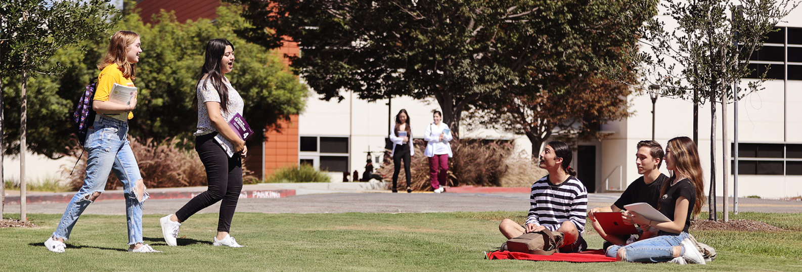 student walking and sitting on campus