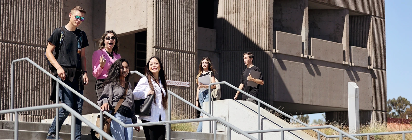 students walking and talking on campus