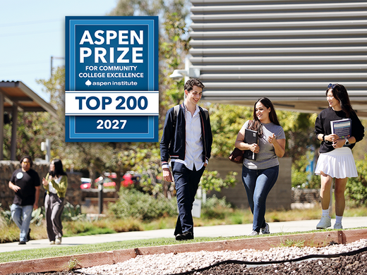 students walking on campus with Aspen prize box showing top 200