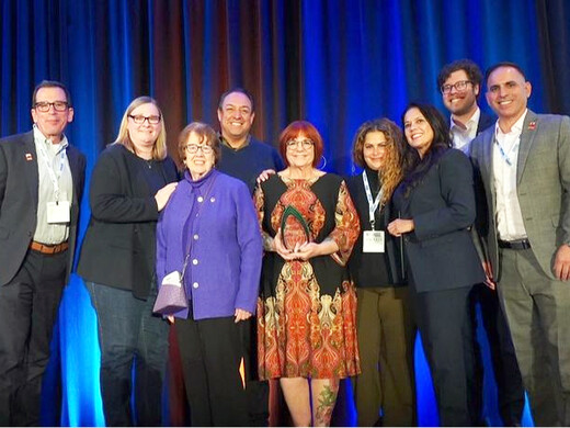 photo of socccd accepting accca award