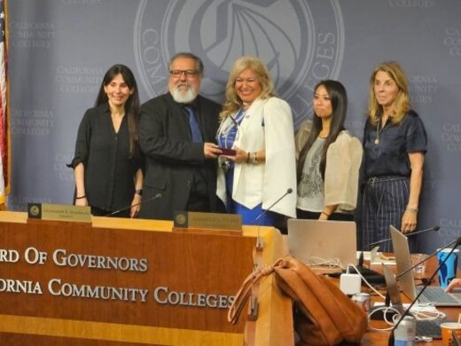 desiree ortiz poses with Board of Govs for the CA Community Colleges