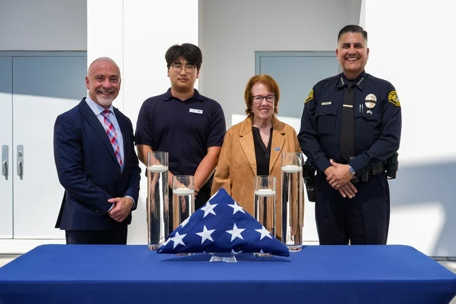 president hernandez, student trustee shin, board president inmon, and chief of saddleback police pose