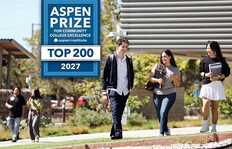 students walking on campus with Aspen prize box showing top 200