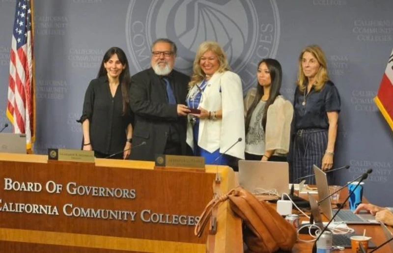 desiree ortiz poses with Board of Govs for the CA Community Colleges