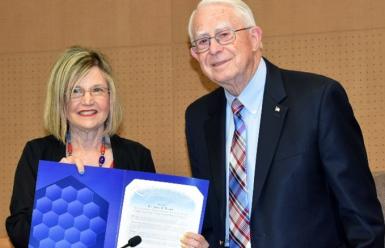 Marcia Milchiker presenting a resolution to james wright