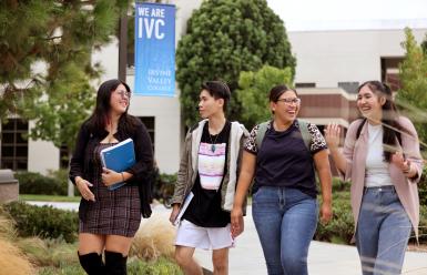 students walking and talking on campus