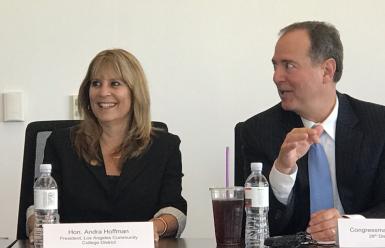 two people sitting at conference