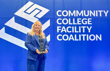 ann-marie gabel posing with award