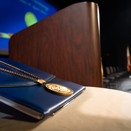 investiture stage with medal